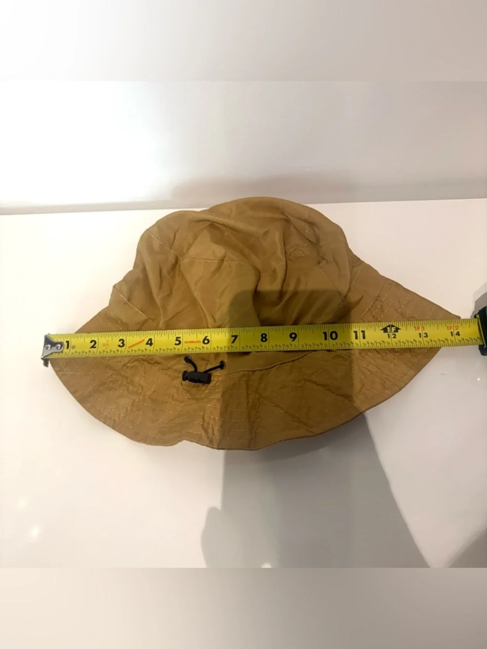 Lightweight Brown Bucket Hat with Red-Orange Wave Detail Never used